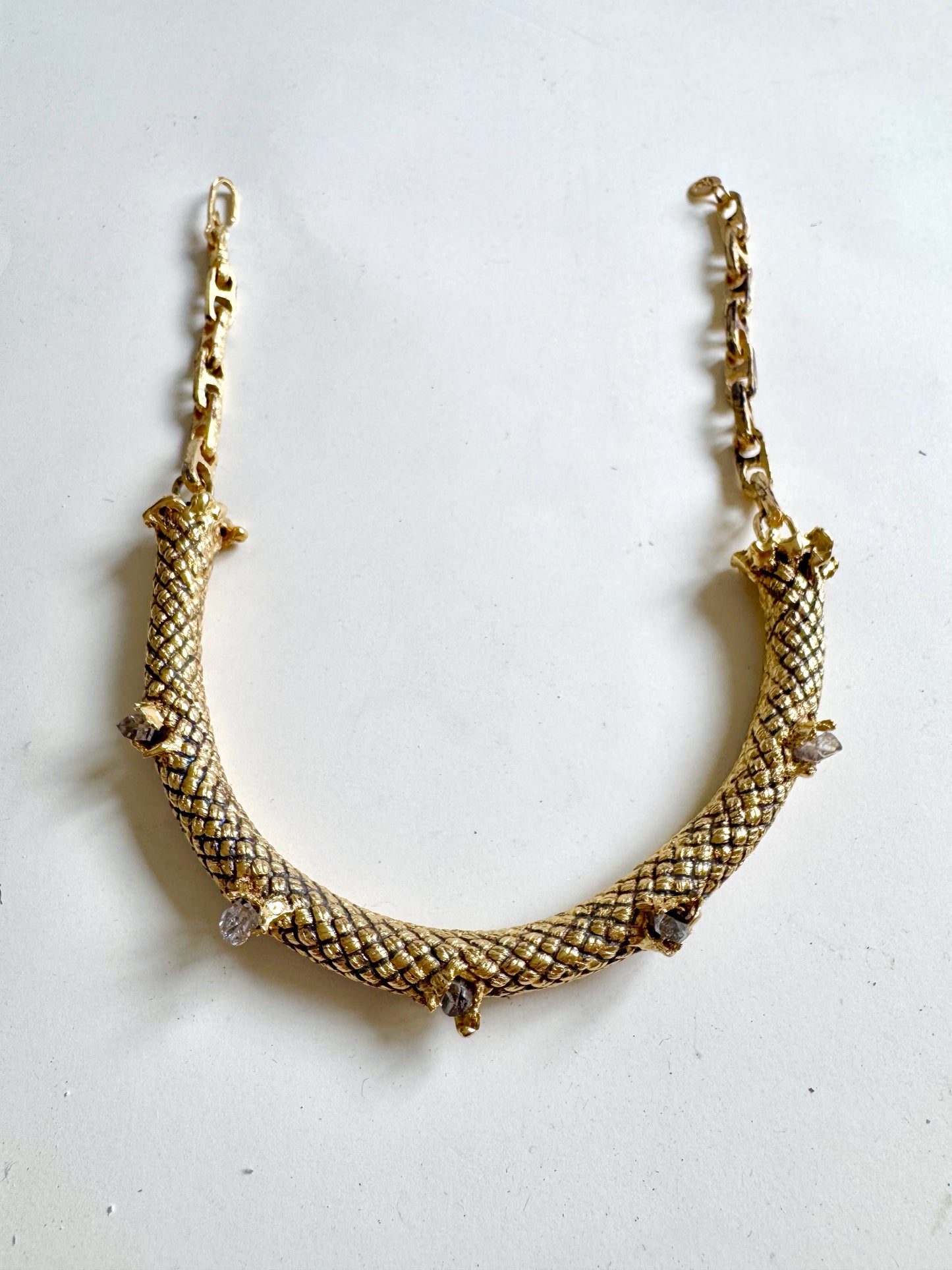 Gold necklace with textured by Angela Lago