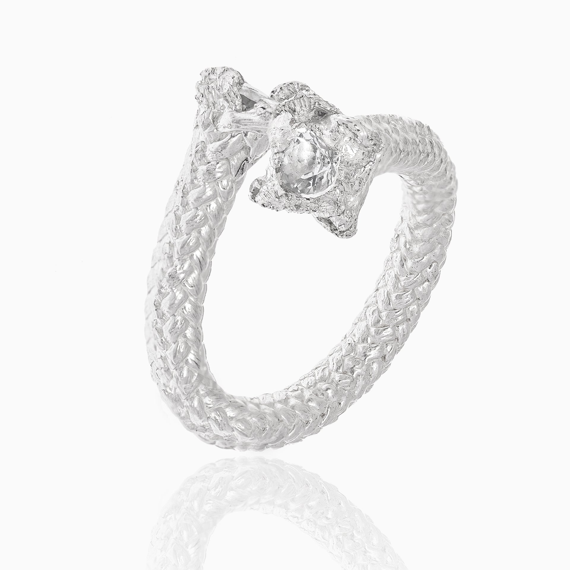 The Aquamarine Artisanal Rope Ring in Sterling Silver, showcased against a white background, features a woven band and a center aquamarine.