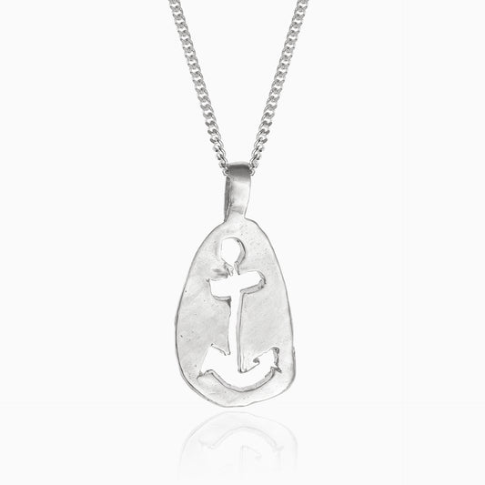 A sterling silver necklace with an oval pendant featuring a cut-out anchor design, perfect for maritime jewelry lovers. The chain is a simple linked chain. This exquisite piece, named the "Anchor Sketch Pendant Inspired by Bernard Moitessier’s Spirit," beautifully captures nautical elegance.