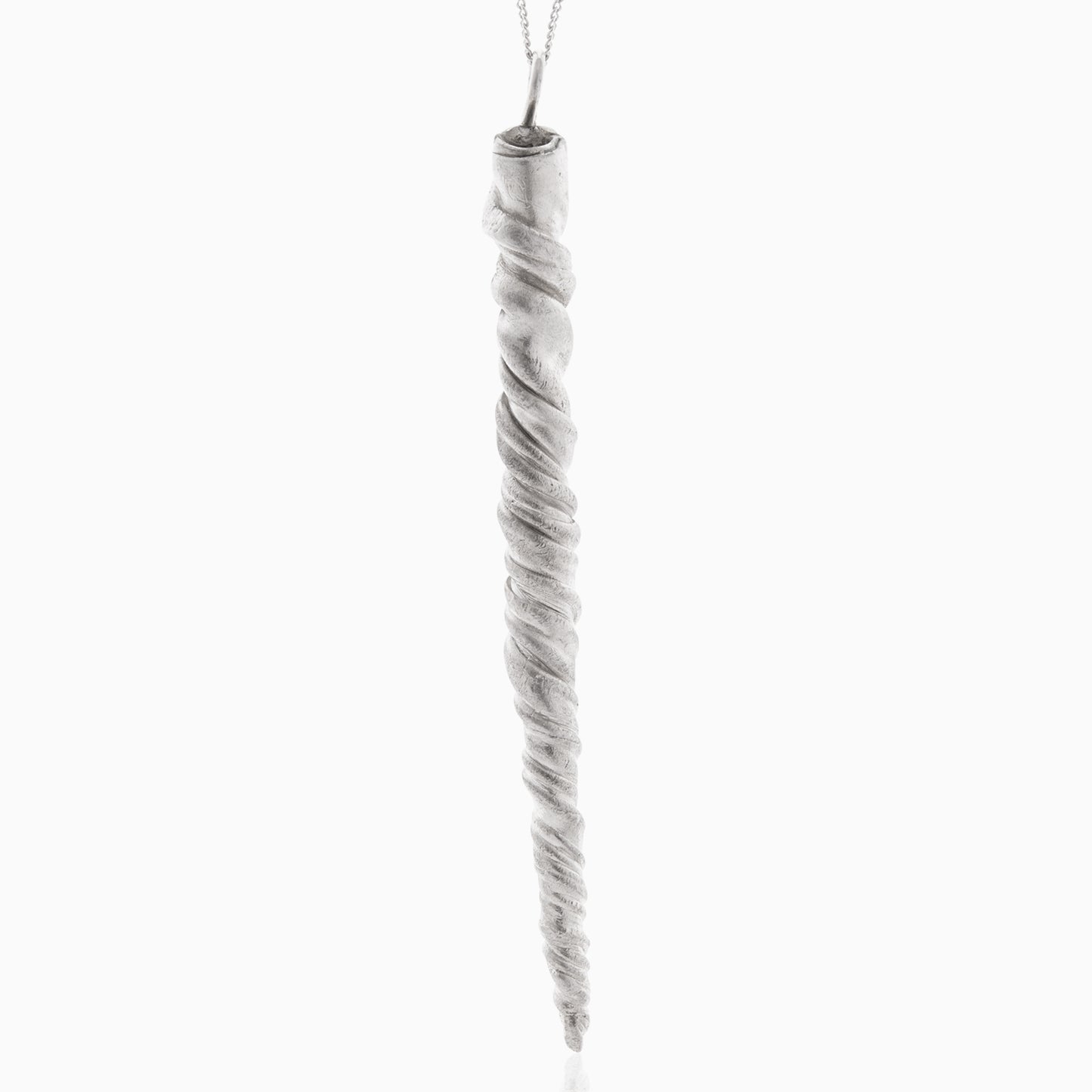 A Narwhal Tusk Handmade Tooth Pendant, featuring a twisted, elongated design with detailed texture and suspended from a thin sterling silver necklace, is handcrafted by Angela Lago.