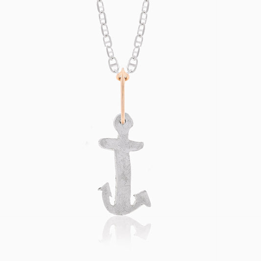 A sterling silver jewelry piece, the handmade Underwater Anchor Pendant by Angela Lago, hangs from a silver chain link necklace against a plain white background.